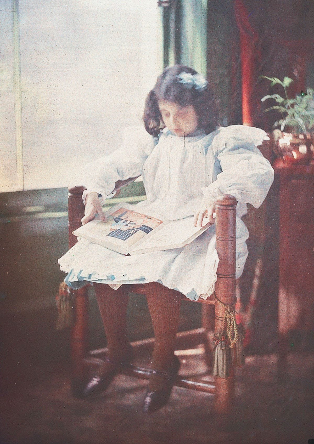 1909 "Peggy reading."